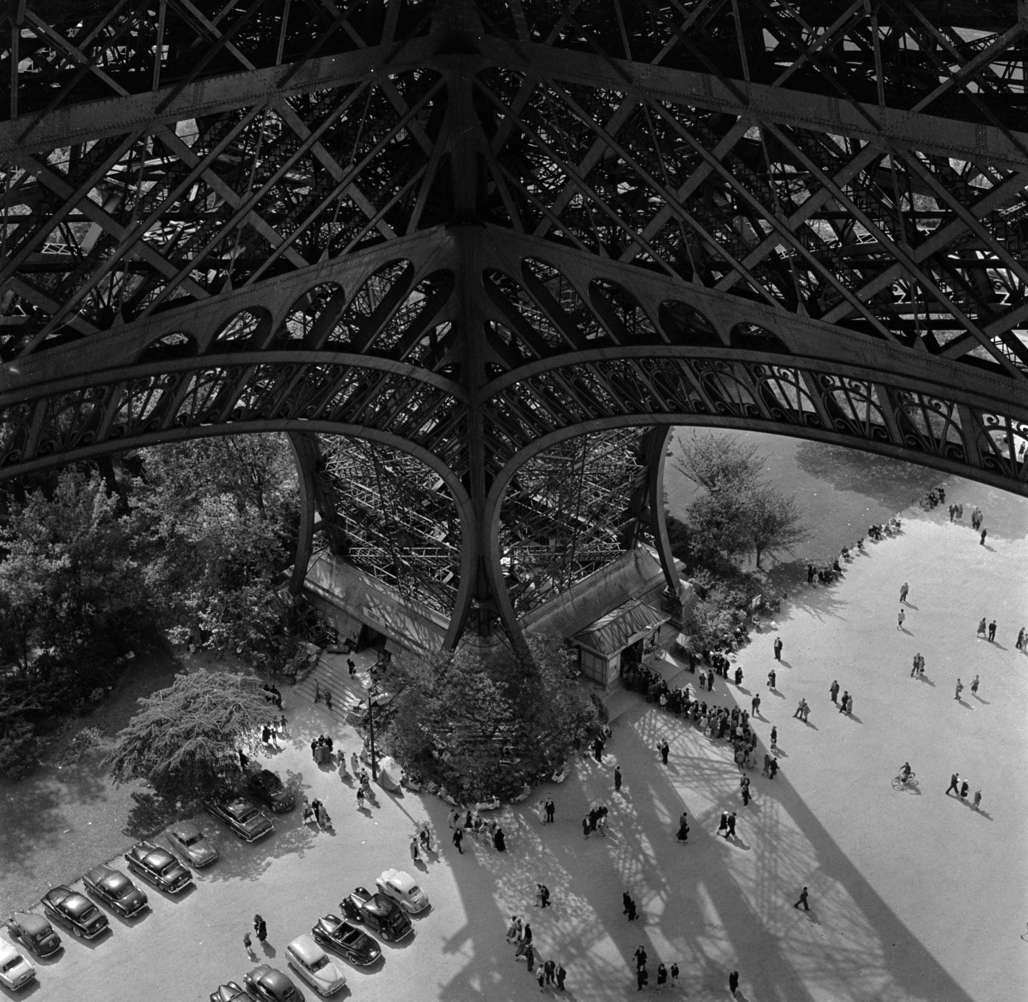 Tourists queue up to climb the Eiffel Tower in Paris in 1889 during the Paris World Fair. The 1889 World's Fair brought millions of visitors to Paris, with nearly two million there to see the Eiffel Tower.
