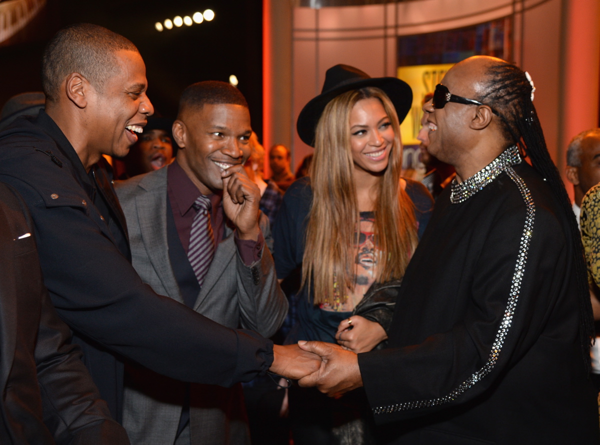 Music icons Jay-Z shook hands with Stevie Wonder as Beyonce and Jamie Foxx looked on in awe. The musicians were in Los Angeles to attend the Stevie Wonder: Songs in the key of Life - An All-Star Grammy Salute on Feb. 10, 2015.