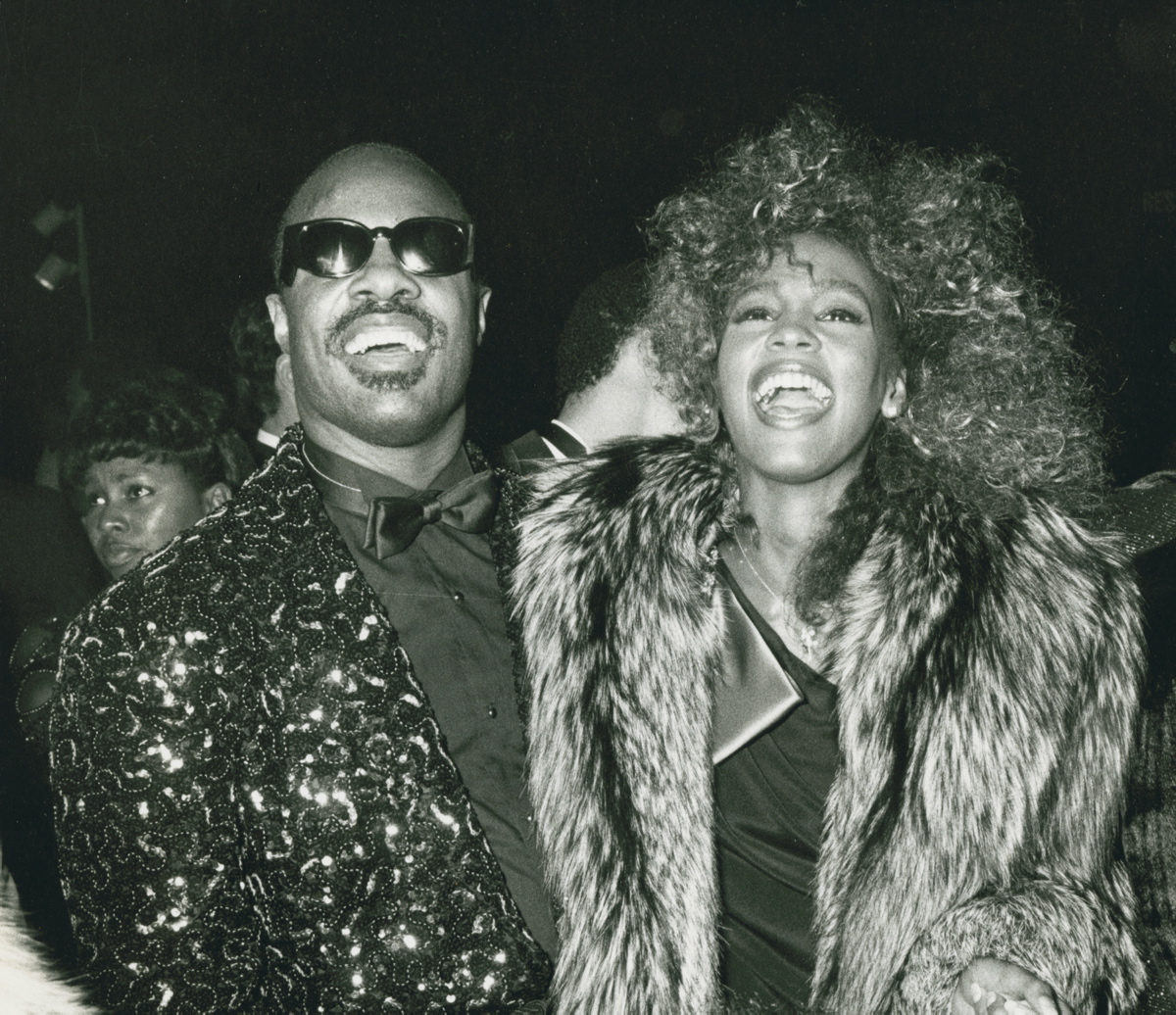 Stevie Wonder and Whitney Houston were all smiles while attending the 13th Annual American Music Awards on Jan. 27, 1986, at the Shrine Auditorium in Los Angeles, Calif.