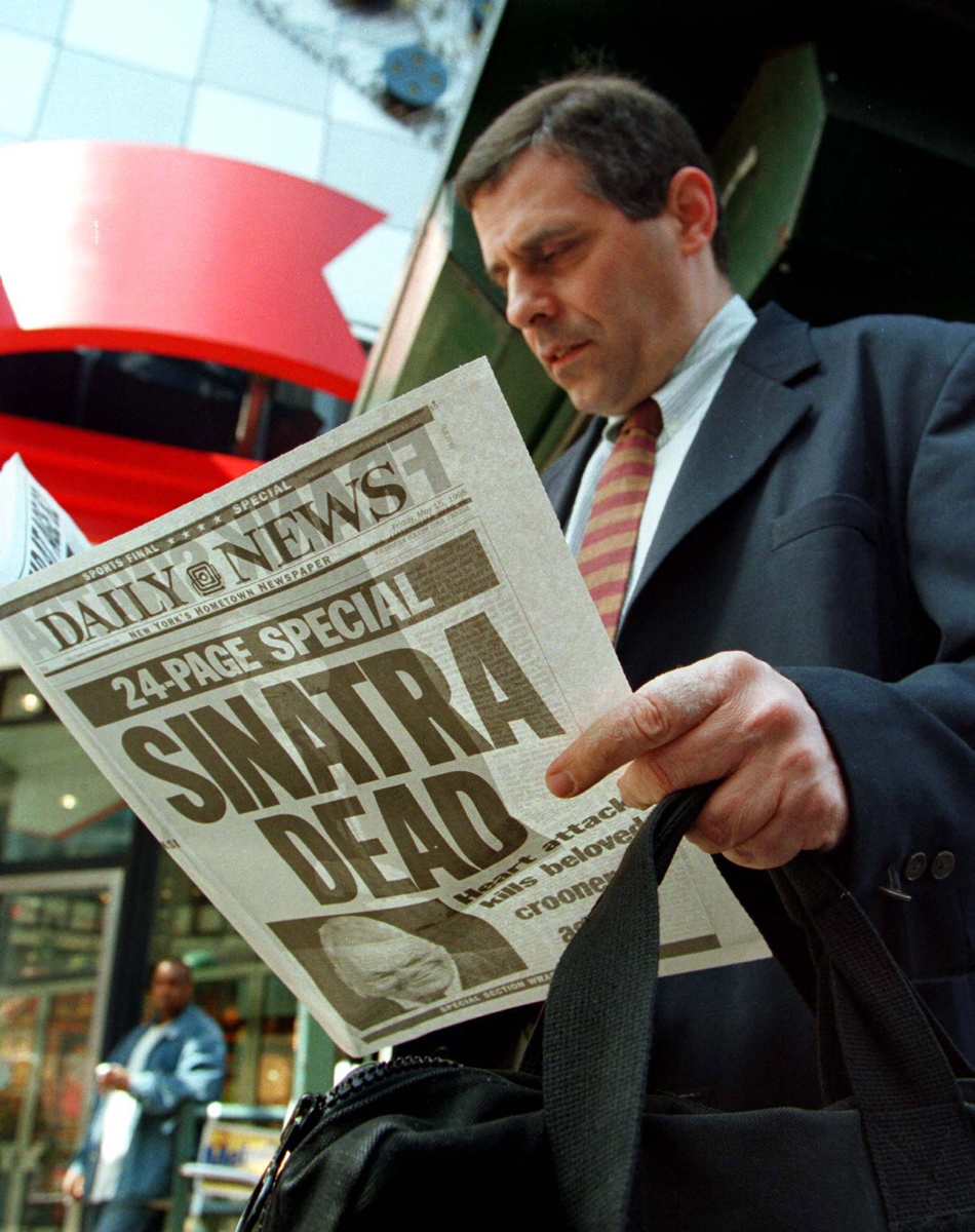 A man in New York's Times Square reads a special edition of the New York Daily News reporting the death of Frank Sinatra the following day. Today his legacy lives on everywhere, especially in his hometown of Hoboken where there is a park, post office and residence hall at Montclair State University named in his honor. Many art schools, including the Frank Sinatra School of the Arts in Astoria, Queens and the Frank Sinatra Hall at the USC School of Cinematic Arts in Los Angeles, Calif., are also named after him.