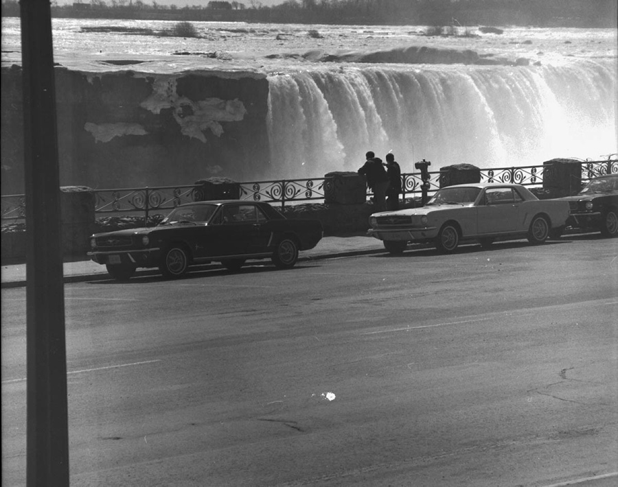 In April 1964, Ford asked a group of journalists to drive the new Mustang on a 750-mile road trip to test the muscle car's durability and reliability. Here, the cars are seen at Niagara Falls.