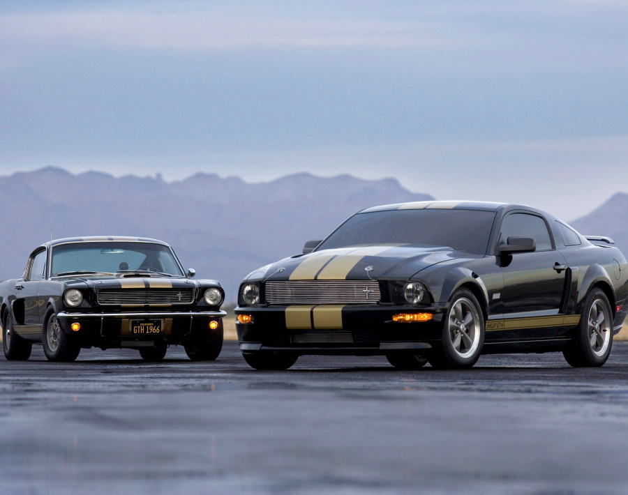 Who knew twins could be separated by 40 years? The 2006 Ford Shelby GT-H brought back the black paint job and gold racing stripes of the Shelby/Hertz GT350H 