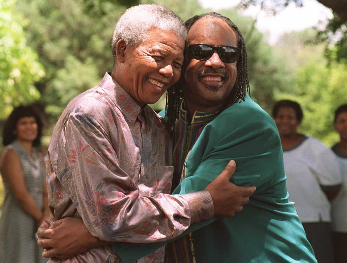 South African President Nelson Mandela embraced Stevie Wonder in Pretoria, South Africa at the presidential residence on Feb. 6, 1996. Mandela praised Wonder for his involvement in anti-apartheid activities when the African National Congress was still a banned organization in South Africa on Feb. 6, 1996.